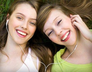 Girls from Charlotte show off their good oral hygiene thanks to general dentistry treatments at Advanced Dentistry of Charlotte.